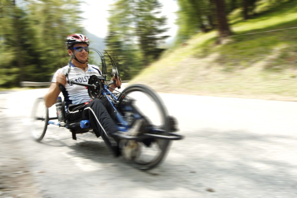 man using his wheelchair bike